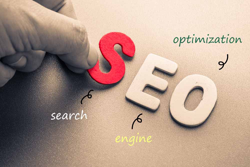 Search Engine Optimization spelled out -with a red letter "S" a white letter "E" and a White letter "O"
